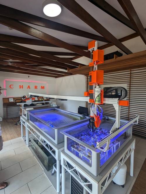 The CHARM coral farming robot, equipped with its new soft robotic hand, in action at the CHARM facility on Magnetic Island. (Source: CSIRO)