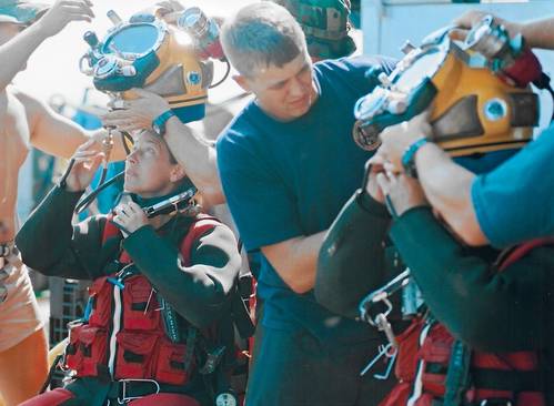 Commander Bobbie Scholley and Captain Chris Murray in Mk 21 with DUI hot water suits in preparations to dive to 240 fsw during MONITOR Expedition 2001. Photo courtesy of US Navy/Released.