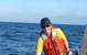 Figure 7. The author, Kevin Hardy, lifts the single sphere hadal lander, DOV Mary Carol, with one hand onto the ship after a test dive off San Diego in 2002. DOV Mary Carol later dove both the Puerto Rico Trench and Aleutian Trench. (Photo by Dr. Art Yayanos, Scripps Institution of Oceanography/UCSD)