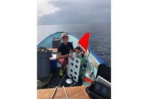 Figure 1.  Graduate student Ashley Nicoll with deep ocean vehicle DOV LEVIN after recovery from an exploratory dive into a nearshore canyon off San Diego, California.  (Photo by Phil Zerofski, Scripps Institution of Oceanography/UCSD.)