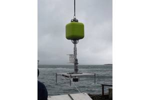 Figure 1.  Schmidt Ocean Institute benthic lander is deployed from R/V Falkor for an operational test.  Syntactic flotation high, integrated acoustic release low, and the expendable anchor weight suspended below the platform deck.  The negative weight of the release is placed close to centerline for trim, and positioned low to act as a counterweight for stability.  No instruments are mounted on the white marine grade HDPE frame. The anchor weight is rigged for recovery after the test.  (Photo by
