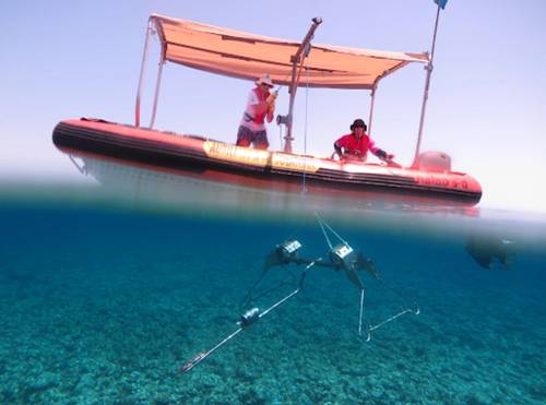 Vessels fitted with a swinging davit arm and winch are ideal for deploying and retrieving Baited Remote Undersea Video (BRUV) systems. In this photo, a Stereo-BRUV system, developed by the Australian Institute of Marine Science (AIMS), is lowered to the seafloor. BRUVs have minimal impact on seafloor communities or the seabed. Photo by Marine Ecology Group - Fish Research, The University of Western Australia